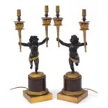 Pair of 19th century ormolu and marble Putti design two branch candelabras converted to electric