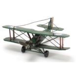 Tinplate model bi-plane, 26cm in length :For Further Condition Reports Please Visit Our Website,