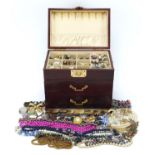 Vintage and later costume jewellery arranged in a Chinese three drawer chest with lift up lid