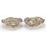 M Bros, two Victorian silver love heart dishes, pierced and embossed with swags and bows, Birmingham