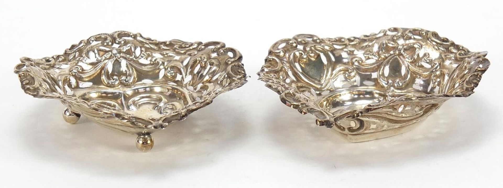 M Bros, two Victorian silver love heart dishes, pierced and embossed with swags and bows, Birmingham