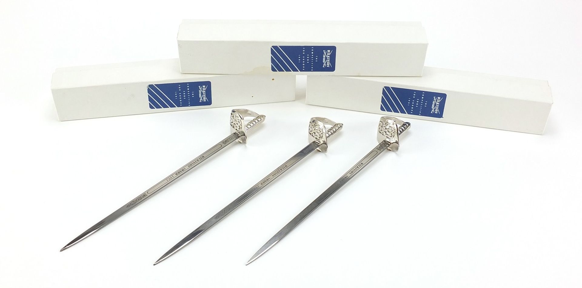 Three Wilkinson Sword letter openers with boxes, each 22cm in length :For Further Condition