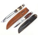 Two military interest knives with leather sheaths including a Bowie example with horn handle, the
