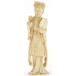 Japanese carved ivory okimono of a young female holding a fan and flowers, 18cm high :For Further