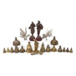 Metalware including brass crinoline table bells and pair of patinated spelter figures, the largest