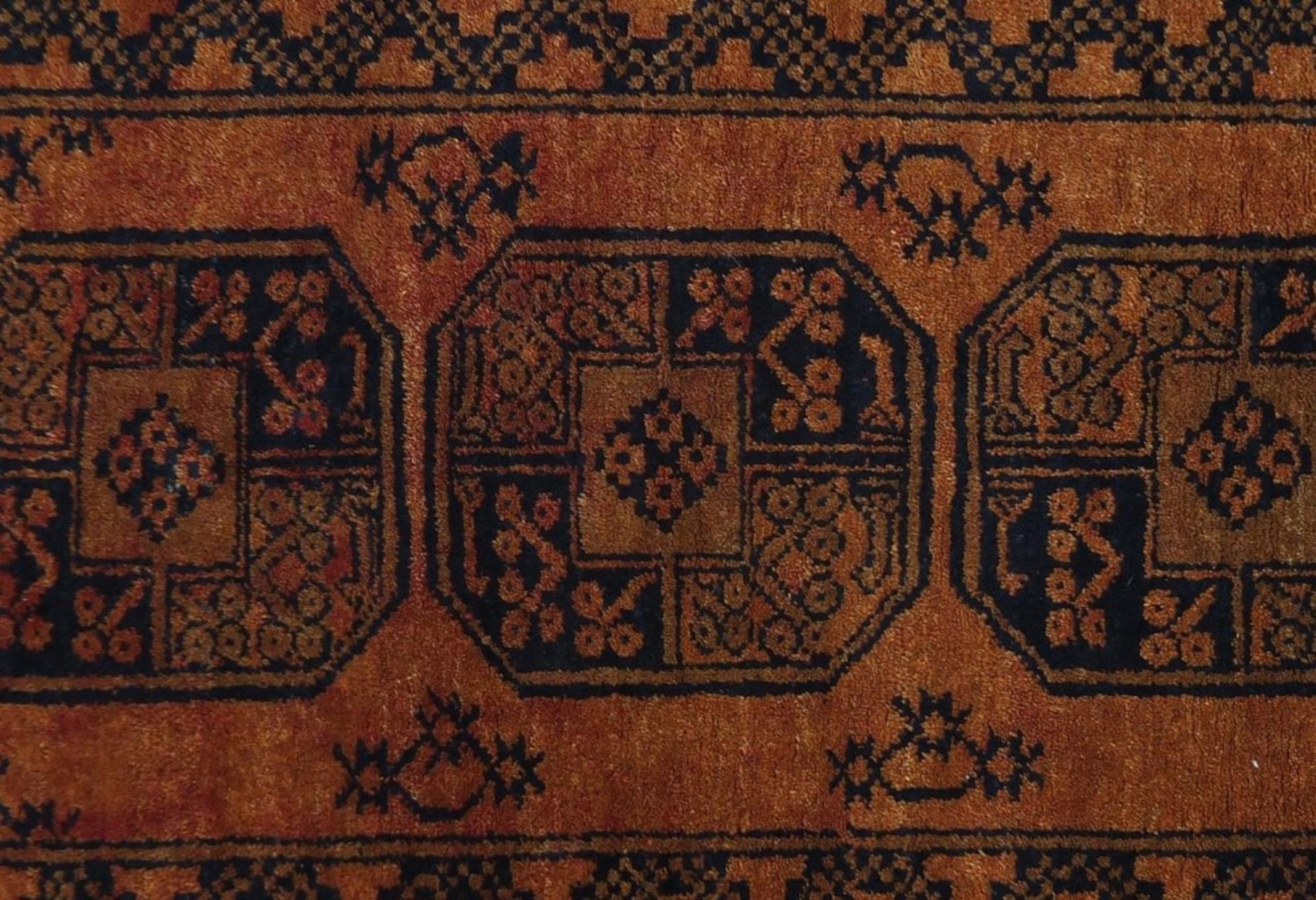 Rectangular Persian orange ground rug having all over geometric design, 125cm x 79cm :For Further - Image 2 of 4