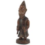 African tribal carved hardwood figure of a tribesman holding two maracas, 33cm high :For Further