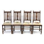 Set of four barley twist dining chairs with needlepoint stuffover seats, each 107cm high :For