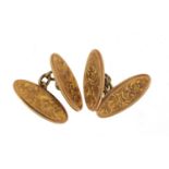 Pair of 9ct gold cufflinks with engraved decoration housed in a velvet and silk lined fitted box,