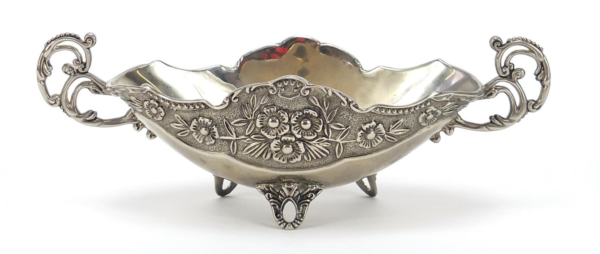 Heavy silver plated twin handled bowl cast with flowers and raised on three feet, 24cm wide :For - Image 2 of 3