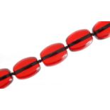 Large cherry amber coloured bead necklace, 80cm in length, 206.8g :For Further Condition Reports