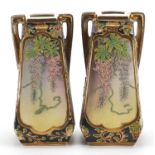 Pair of Japanese porcelain vases with twin handles decorated in relief with flowers, 25.5cm high :