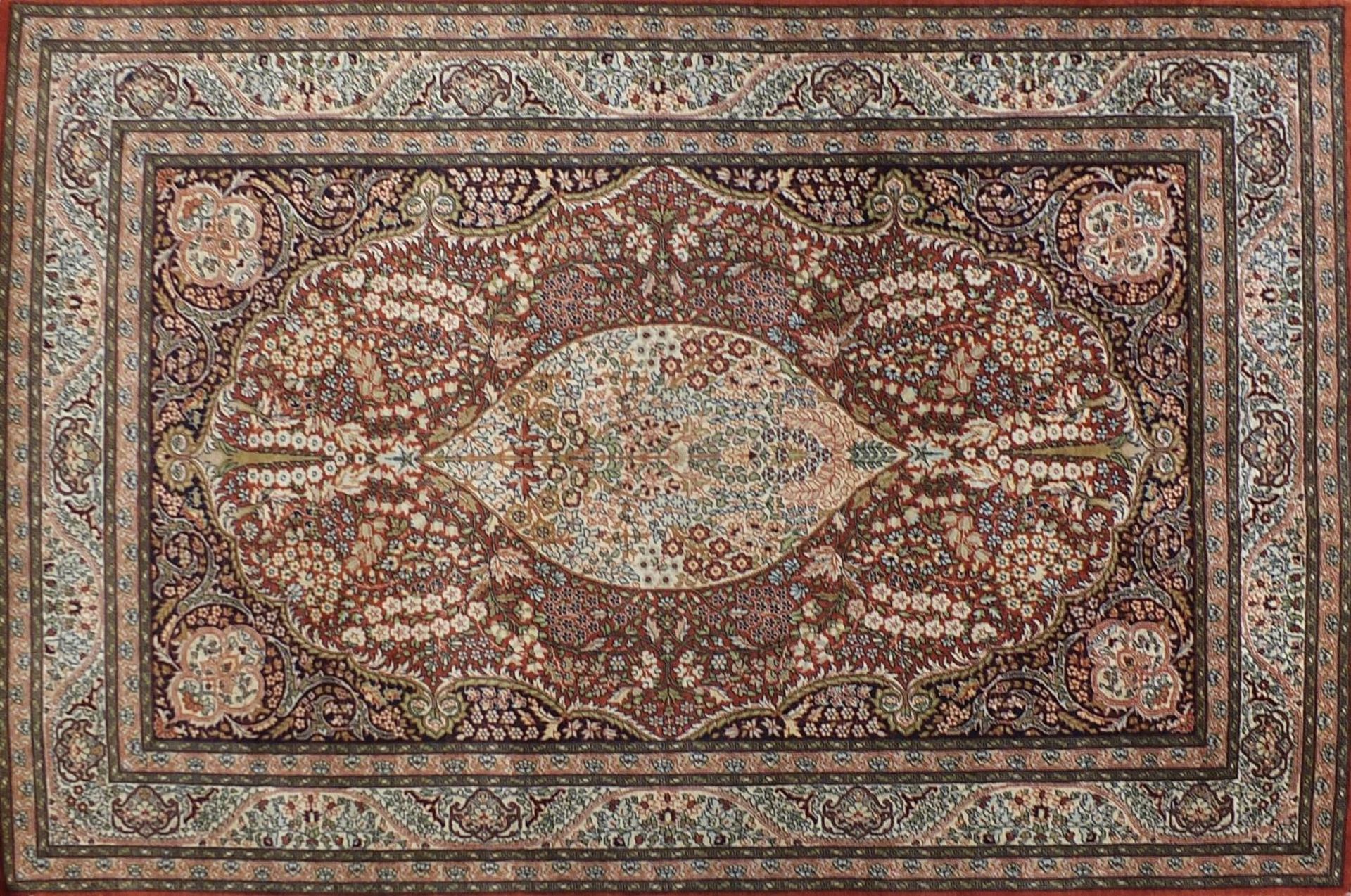 Rectangular Persian rug having an all over floral design with traditional medallion, 224cm x