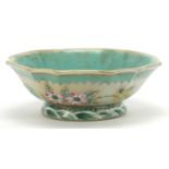 Chinese porcelain footed bowl hand painted in the famille rose palette with a butterfly amongst