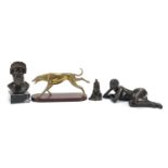 Decorative items including a bronzed study of a nude female, brass greyhound on faux rosewood base
