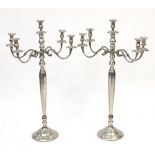 Pair of floor standing chrome plated five branch candelabras, each 99cm high :For Further