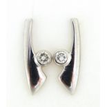 Pair of 9ct white gold diamond stud earrings, 1.6cm high, 2.2g :For Further Condition Reports Please