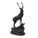 Large patinated bronze stag raised on a shaped marble base, 74cm high :For Further Condition Reports