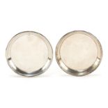 Cartier, pair of circular silver dishes hallmarked London 1942, 7.5cm in diameter, 63.0g :For