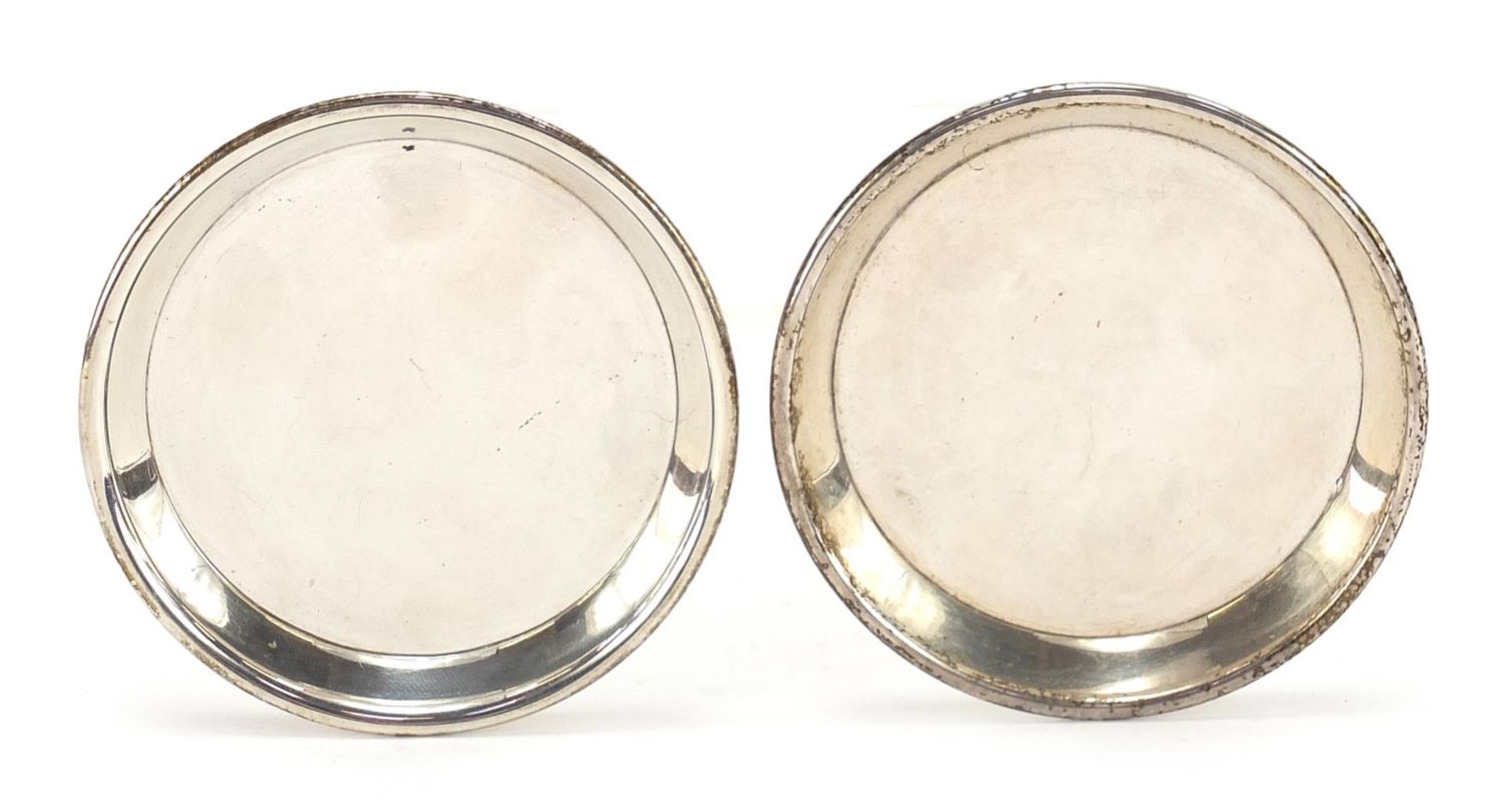 Cartier, pair of circular silver dishes hallmarked London 1942, 7.5cm in diameter, 63.0g :For