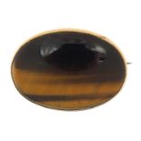 Cabochon tiger's eye brooch with gold coloured metal mount, 3.2cm wide, 7.7g :For Further