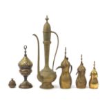 Middle Eastern metalware including a Turkish incense burner and coffee pots, the largest 60cm