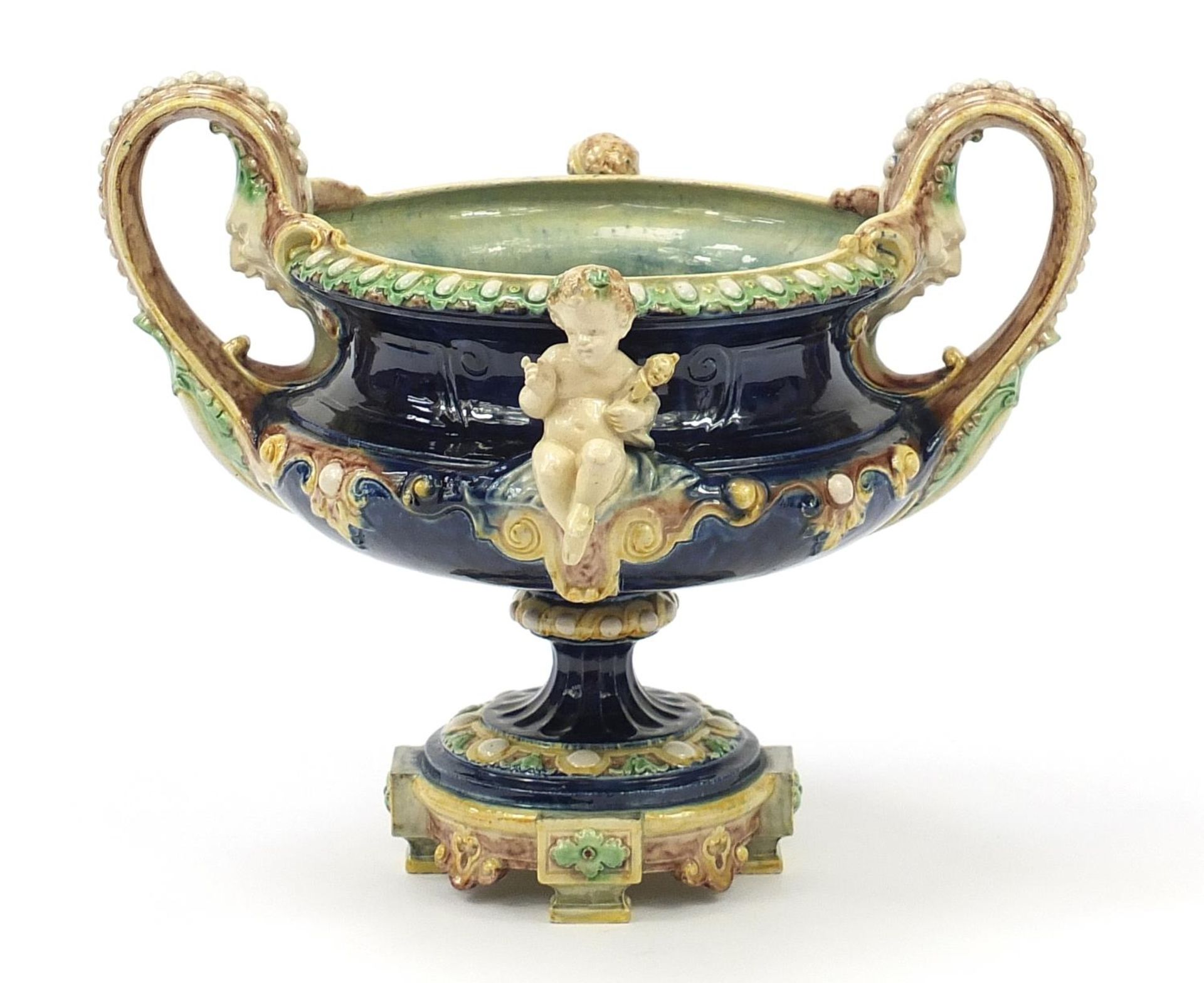 19th century Majolica centrepiece with twin handles surmounted with two Putti, 27.5cm high x 33. - Bild 3 aus 6