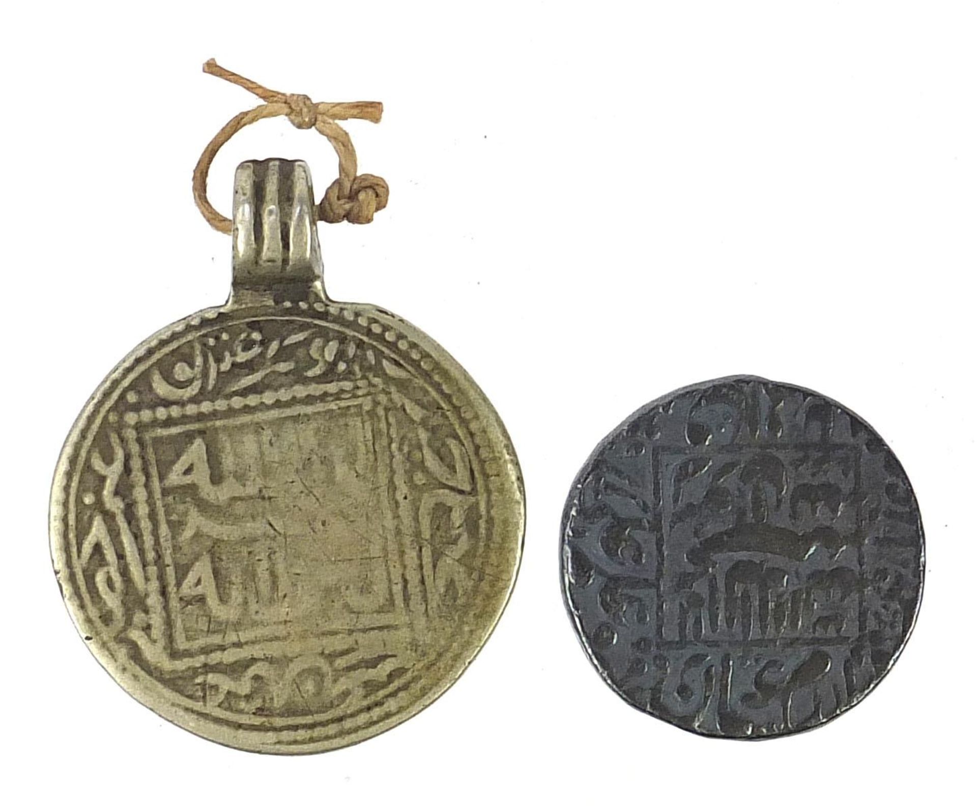 13th century Arabian coin and one other, the largest 4cm high :For Further Condition Reports