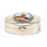 Oval sterling silver pill box, the hinged lid enamelled with a female golfer, 3.2cm wide, 11.5g :For