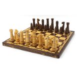 Large carved wood chess set with folding board, the largest pieces each 14cm high, the board 60cm