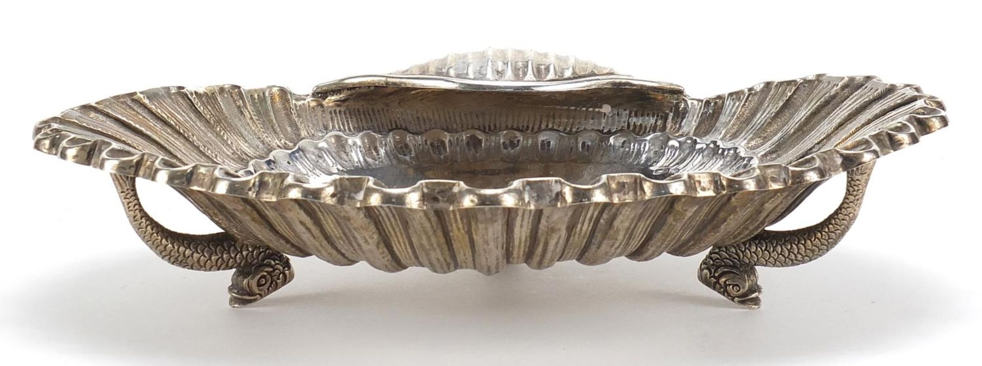 Continental silver shell shaped bowl raised on three dolphin feet, 23cm wide, 366.2g :For Further