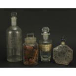 Four 19th century apothecary glass jars and an Art Deco frosted and clear glass scent bottle, one