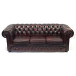 Thomas Lloyd, Chesterfield sofa bed with ox blood leather button back upholstery, 72cm H x 207cm W x
