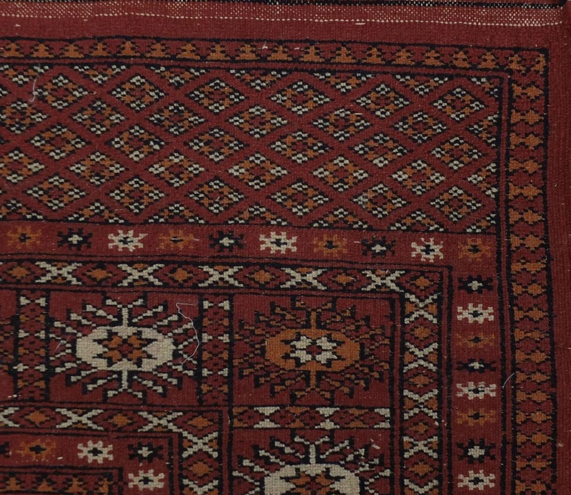 Rectangular Persian rug having a traditional repeat medallion, 200cm x 125cm :For Further - Image 4 of 4