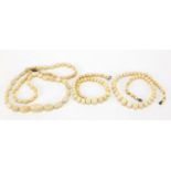 Three ivory bead necklaces, the largest 80cm in length, total 154.4g :For Further Condition