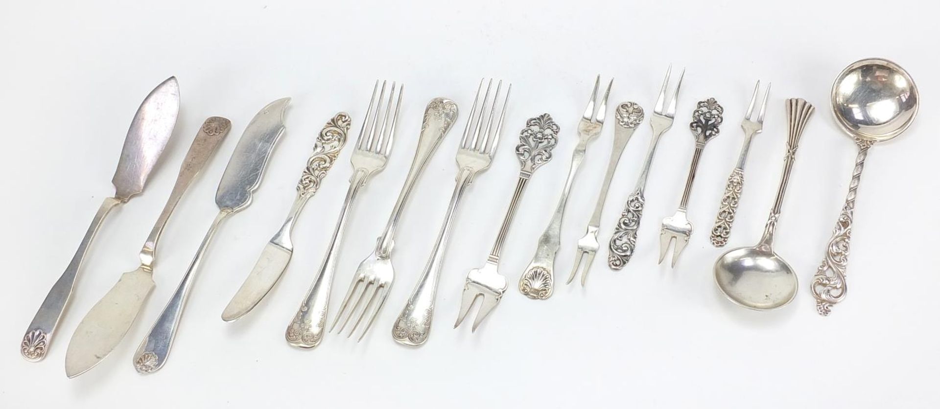 Scandinavian silver and white metal cutlery including a spoon by Broden Lohne and knives by Marius