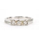 9ct white gold diamond three stone ring with diamond set shoulders, size Q, 3.5g :For Further