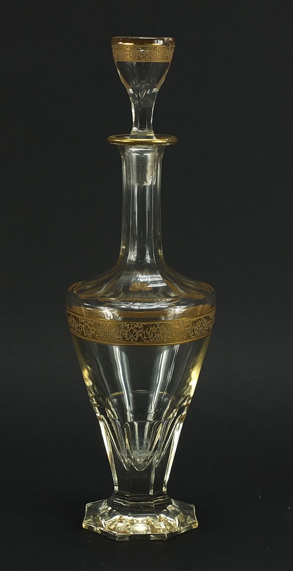 Attributed to Moser, Bohemian glass decanter with gilt foliate bands, 28cm high :For Further