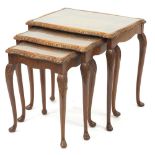 Nest of three burr walnut occasional tables with glass inset tops, the largest 56.5cm H x 58.5cm W x