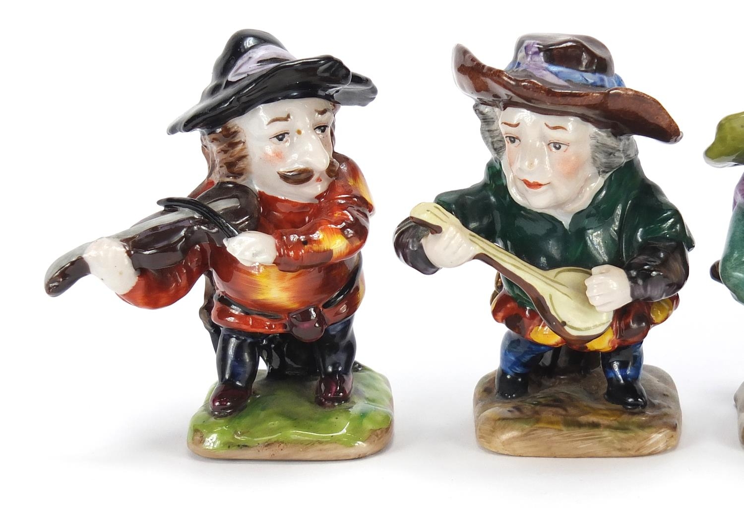 Four Crown Derby style hand painted porcelain dwarf musicians, the largest 9cm high : For Further - Image 2 of 6