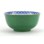 Japanese porcelain green monochrome bowl hand painted with flowers, character marks to the base,