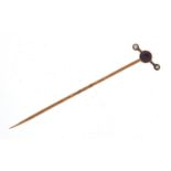 Antique unmarked gold amethyst and seed pearl stick pin housed in a velvet and silk lined fitted