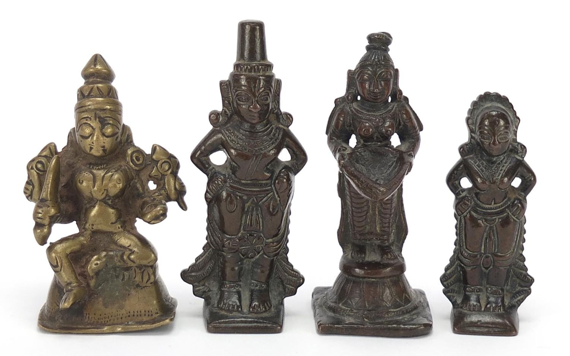 Four Indian patinated bronze votive figures, the largest 10cm high : For Further Condition Reports
