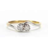 18ct gold and platinum diamond crossover ring, the diamonds approximately 2.5mm in diameter, size O,