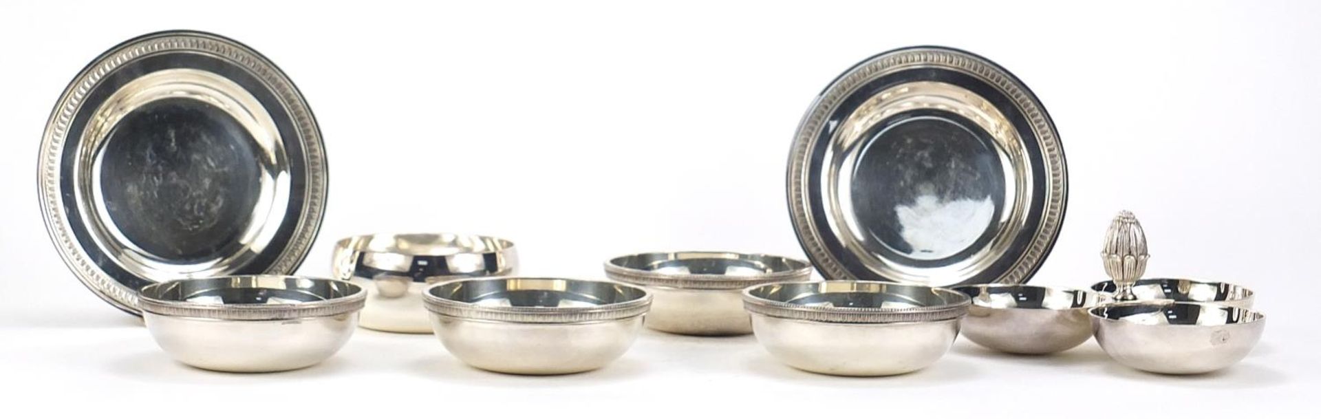 Christofle silver plate including trefoil dish with acorn handle and set of four bowls, the