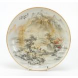 Chinese porcelain plate hand painted with figures in a river landscape, iron red character marks