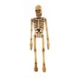 Japanese carved bone skeleton, 10.5cm high : For Further Condition Reports Please Visit Our