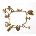 9ct gold charm bracelet with a selection of mostly 9ct gold charms including Genie oil lamp,