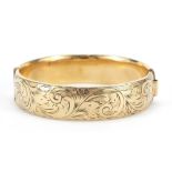 Victorian design 9ct gold metal core hinged bangle with engraved decoration, 7cm wide, 31.0g : For