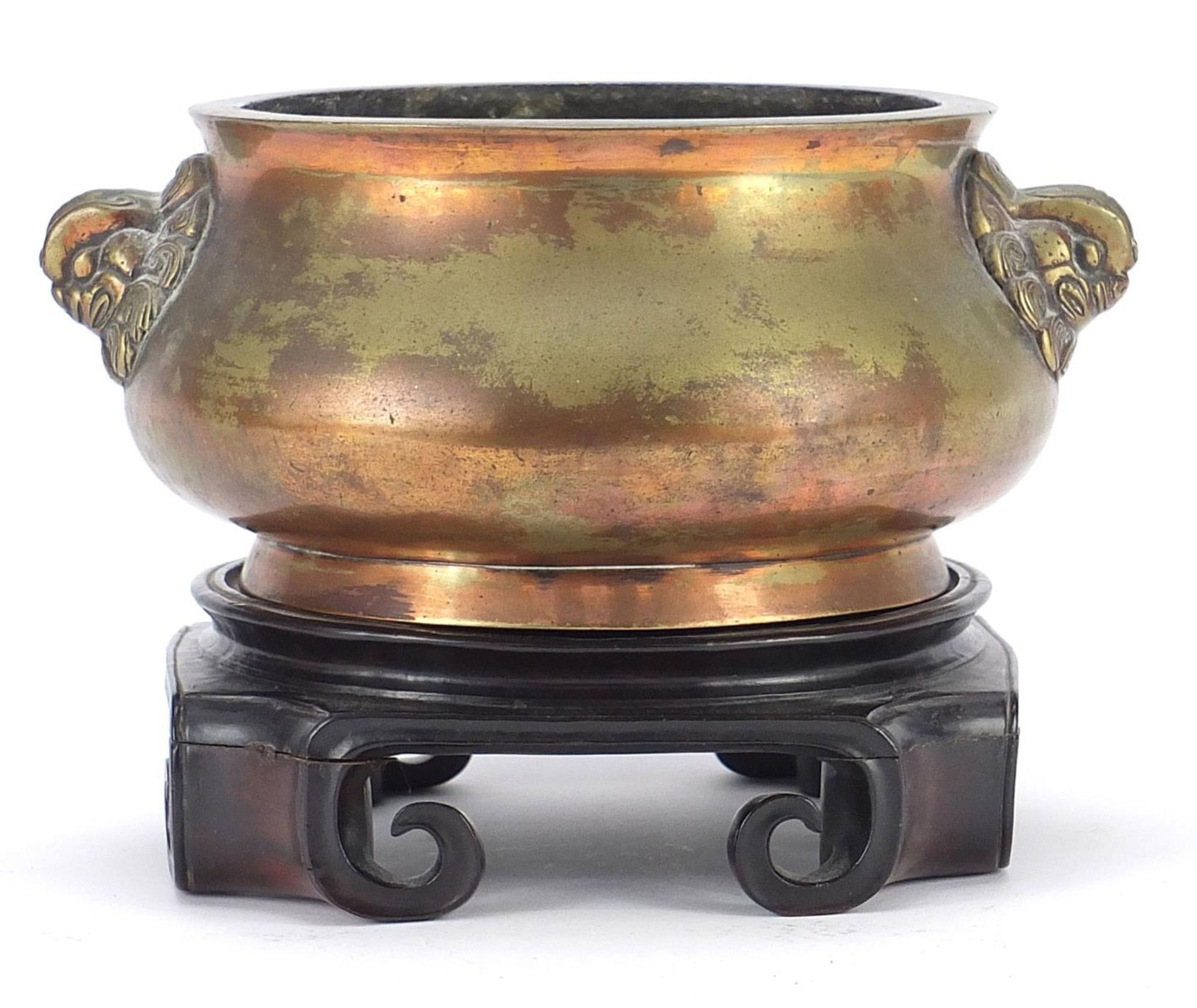 Large Chinese patinated bronze censer with animalia handles raised on a carved hardwood stand, six - Image 6 of 11